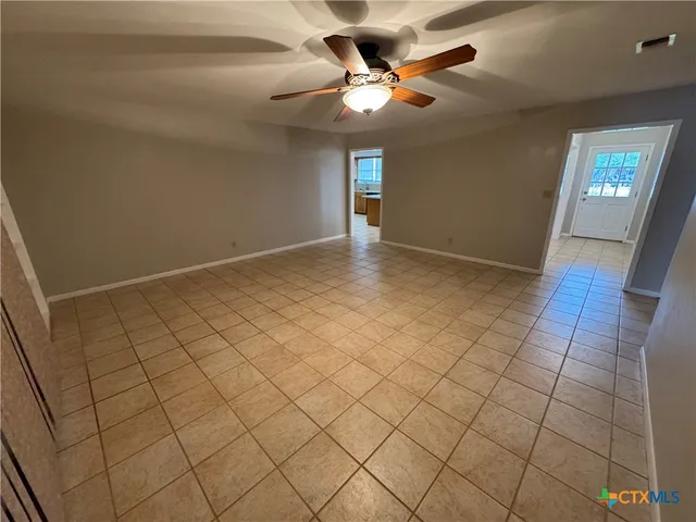 a view of an empty room and window