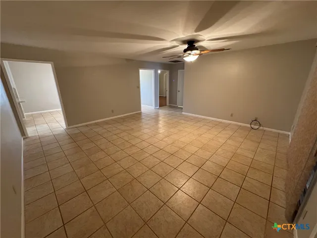 a view of a livingroom and window
