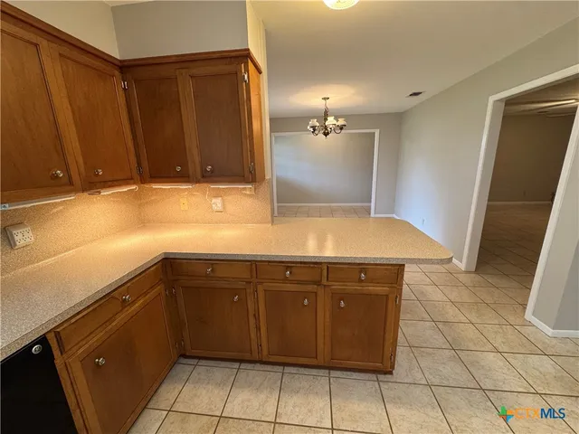 a view of a sink and cabinets
