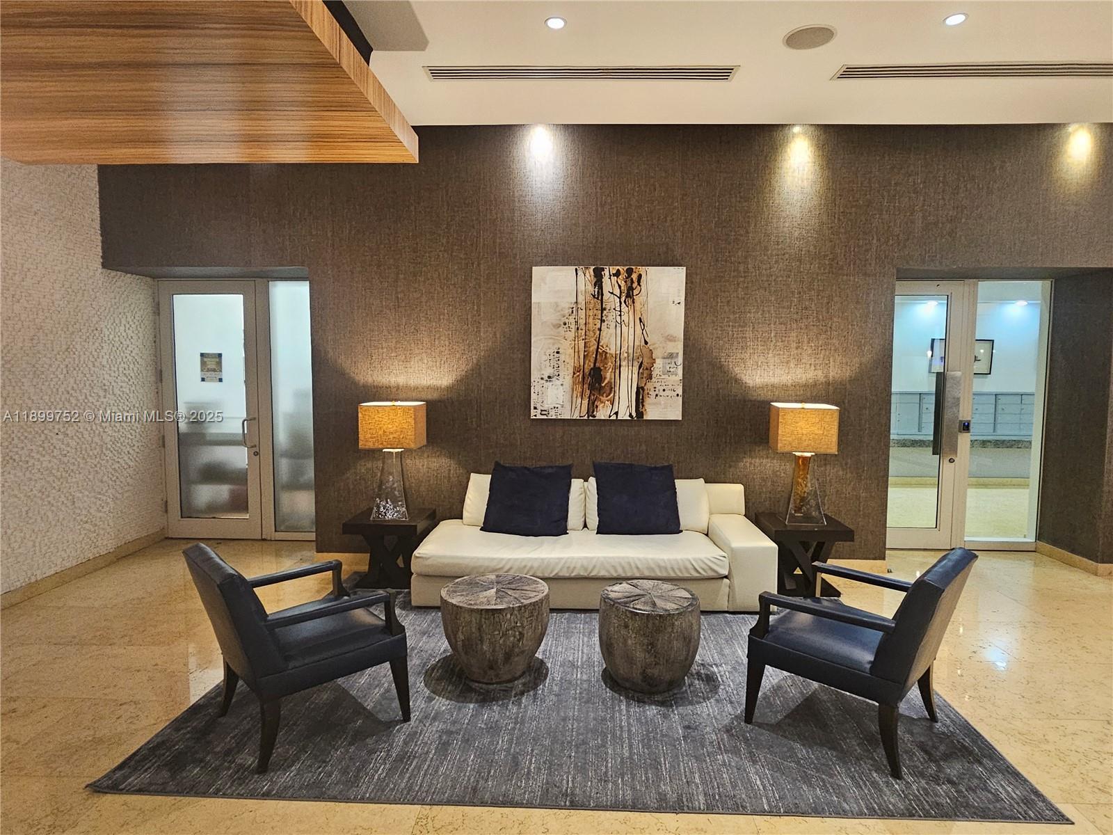 60 Southwest 13th Street, Unit 1900 Miami, FL 33130 - Photo 77 of 95 a living room with furniture and a potted plant