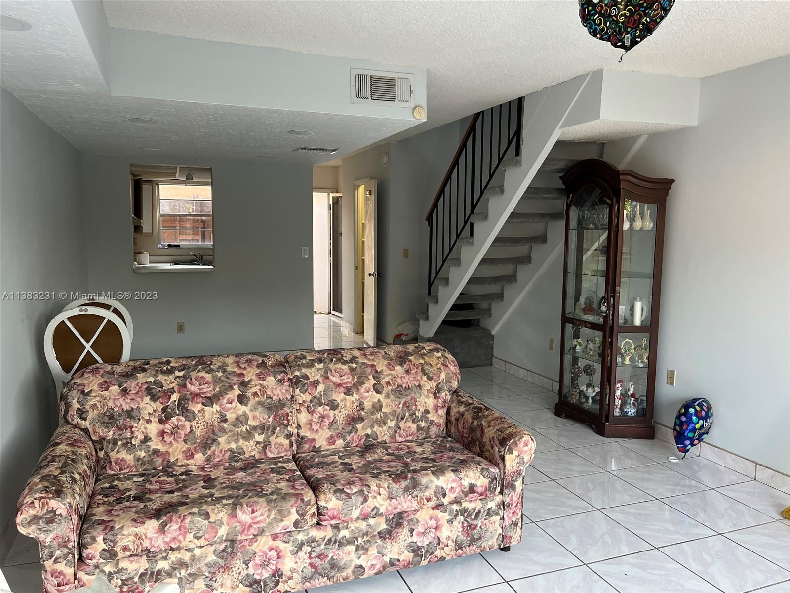 15103 Southwest 81st Street, Unit 213 Miami, FL 33193 - Photo 12 of 22 a bedroom with a bed and dresser