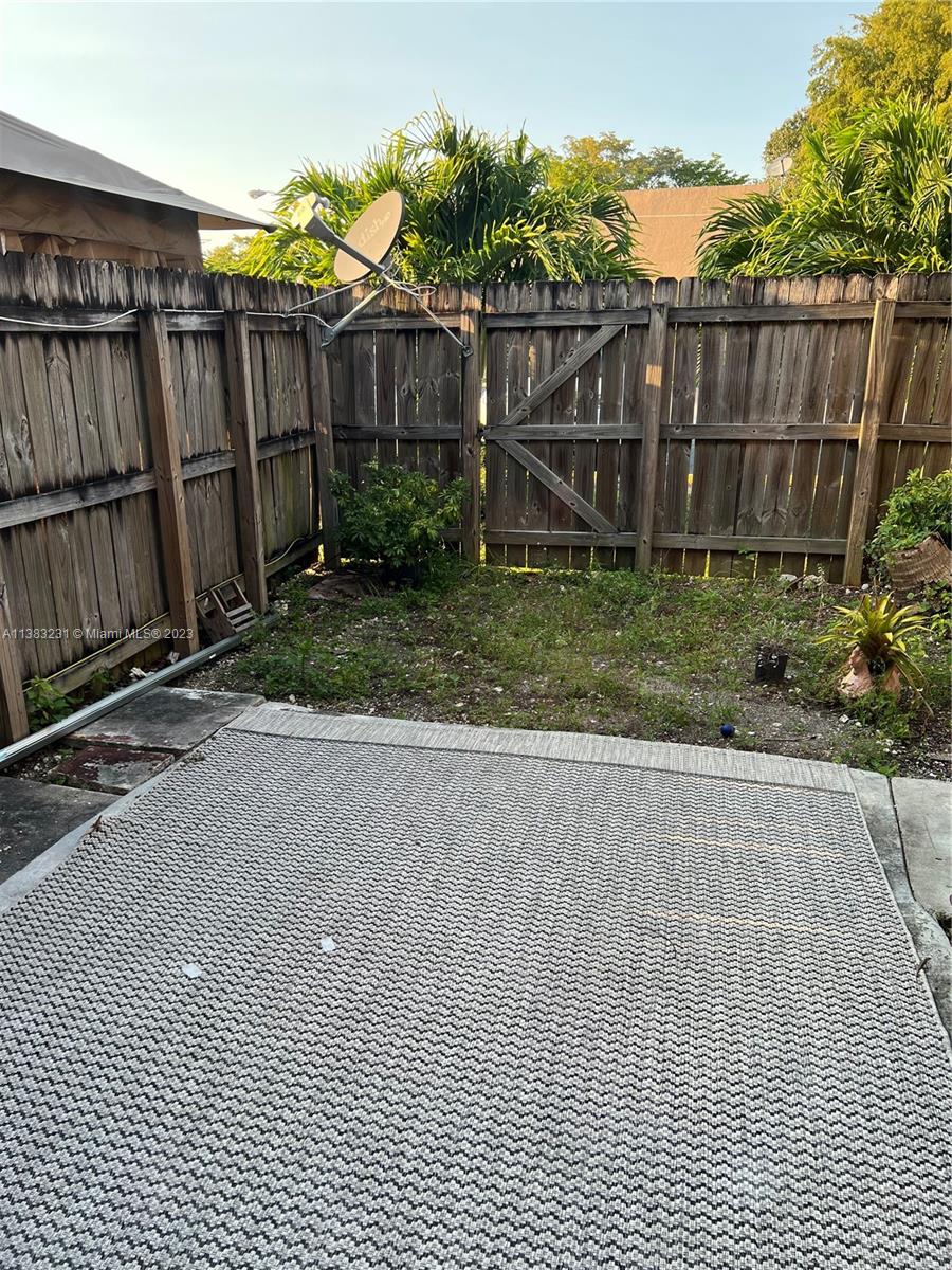 15103 Southwest 81st Street, Unit 213 Miami, FL 33193 - Photo 14 of 22 a view of a backyard