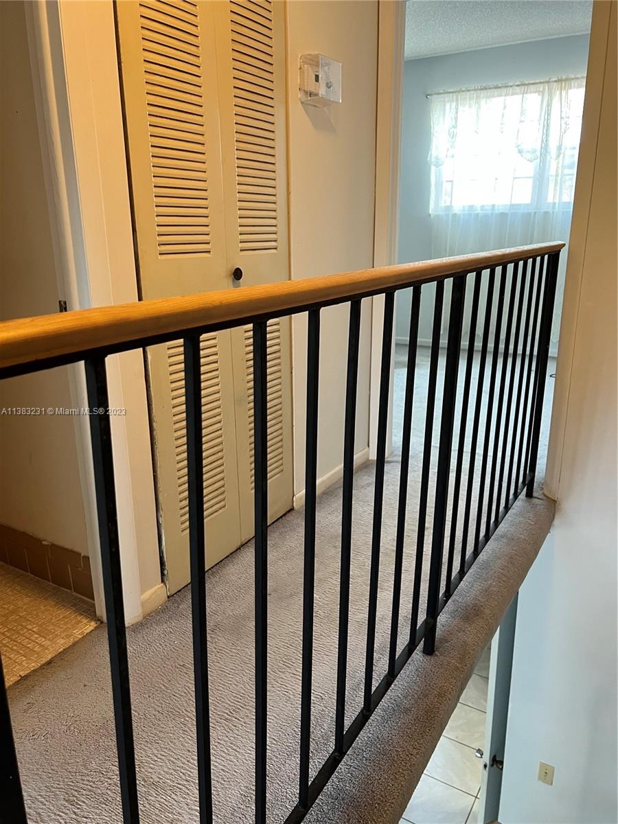 15103 Southwest 81st Street, Unit 213 Miami, FL 33193 - Photo 16 of 22 a view of a balcony with window