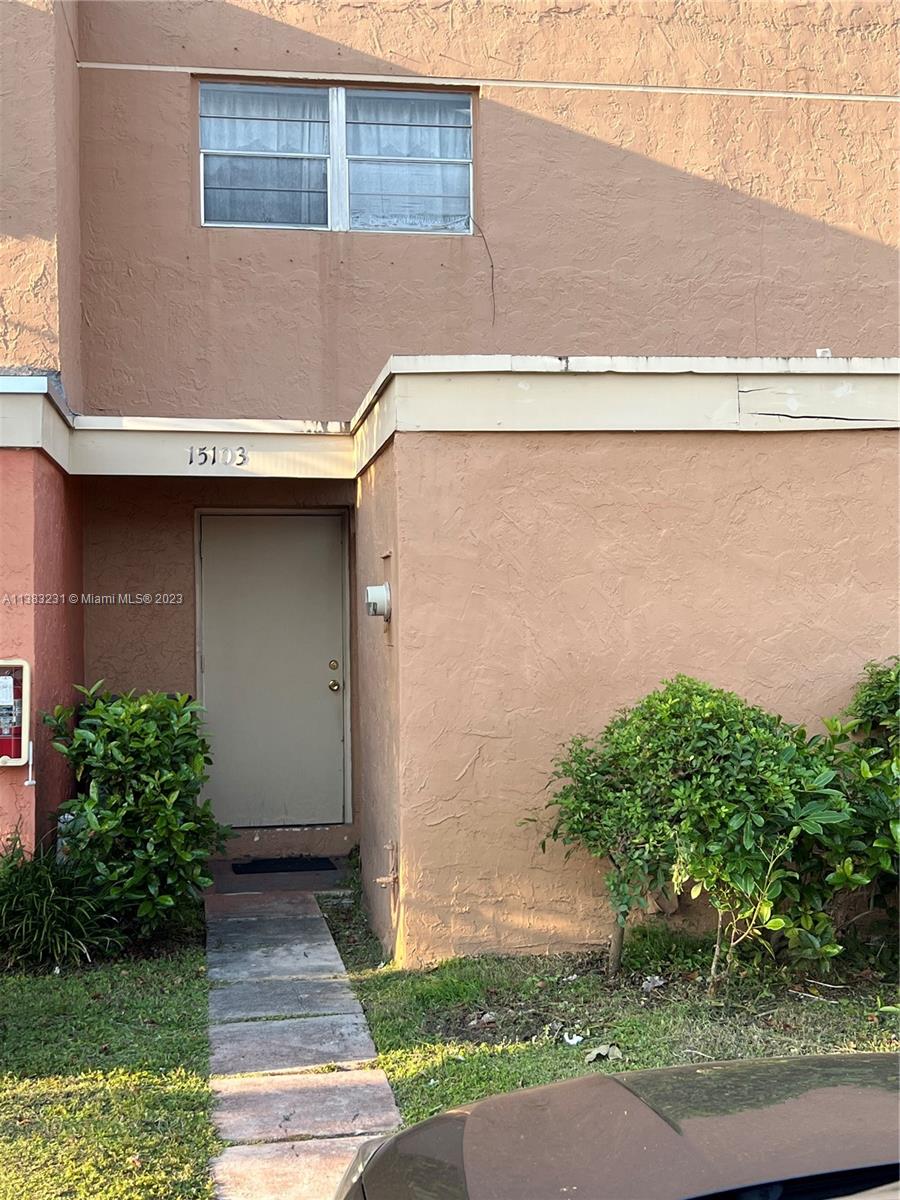 15103 Southwest 81st Street, Unit 213 Miami, FL 33193 - Photo 3 of 22 a side view of a house with a yard