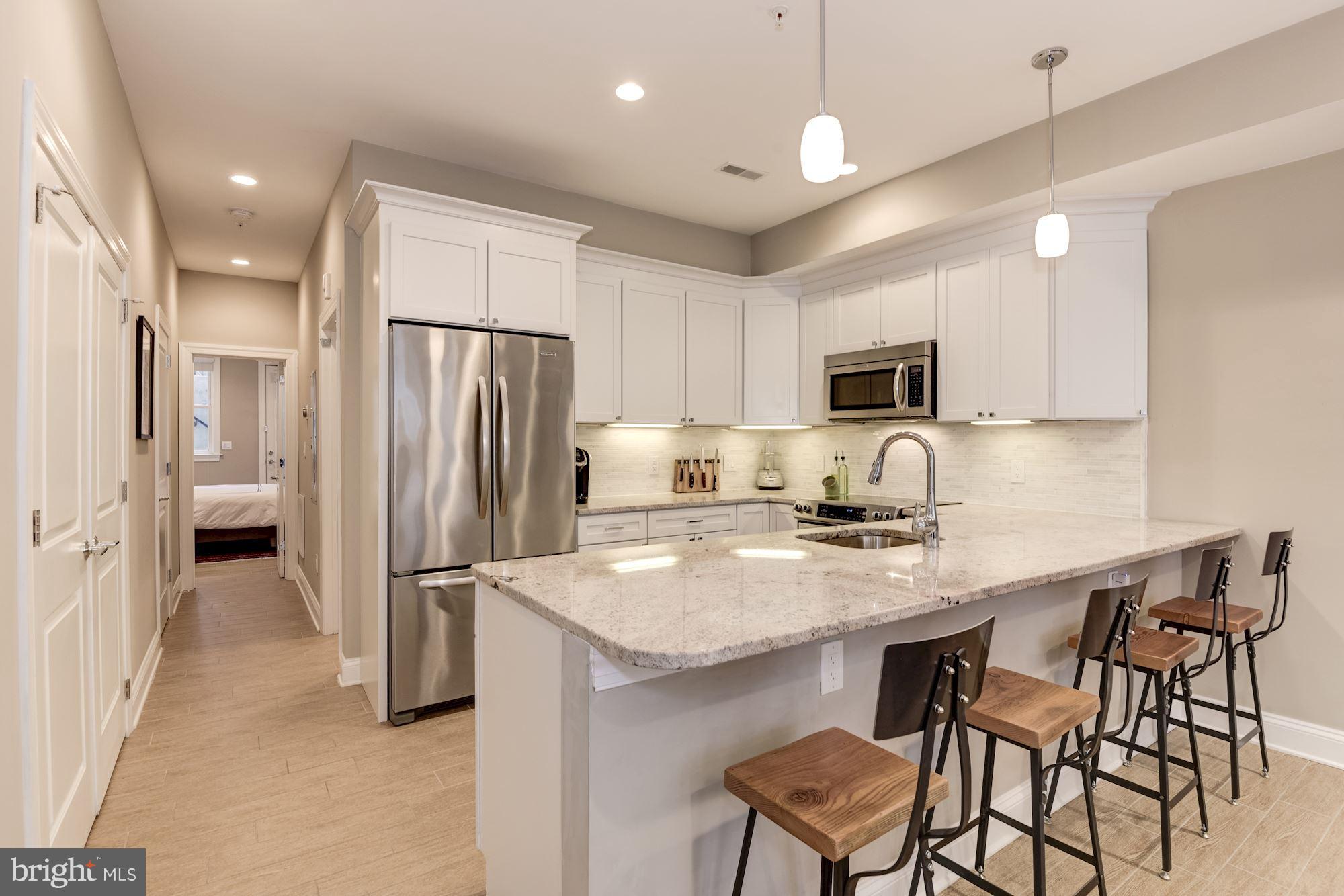1431 Corcoran Street Northwest, Unit 1 Washington, DC 20009 - Photo 5 of 22 Open Kitchen w/ Breakfast Bar