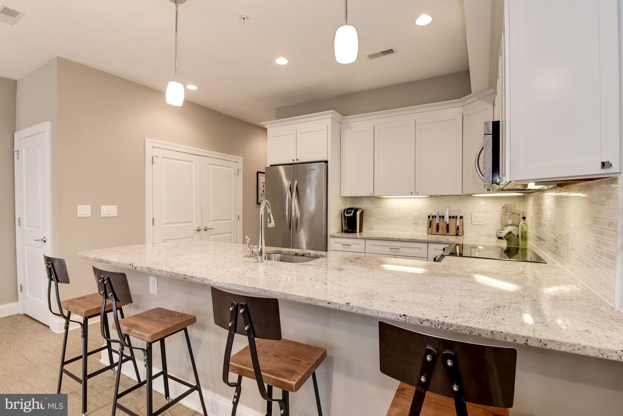 1431 Corcoran Street Northwest, Unit 1 Washington, DC 20009 - Photo 6 of 22 Open Kitchen w/ Breakfast Bar
