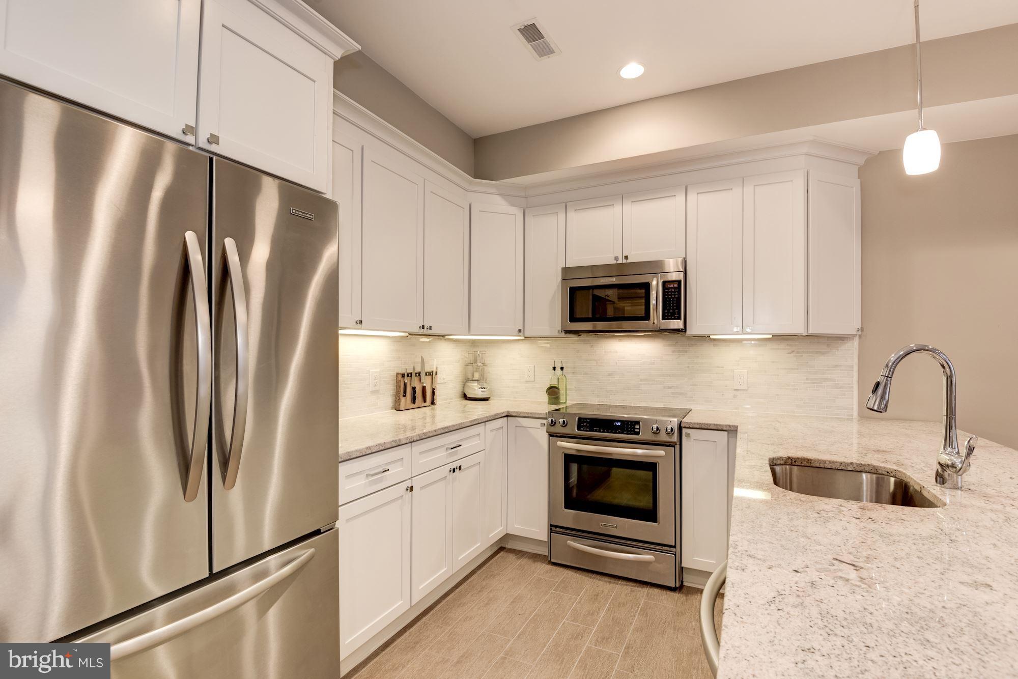 1431 Corcoran Street Northwest, Unit 1 Washington, DC 20009 - Photo 7 of 22 Open Kitchen w/ Breakfast Bar