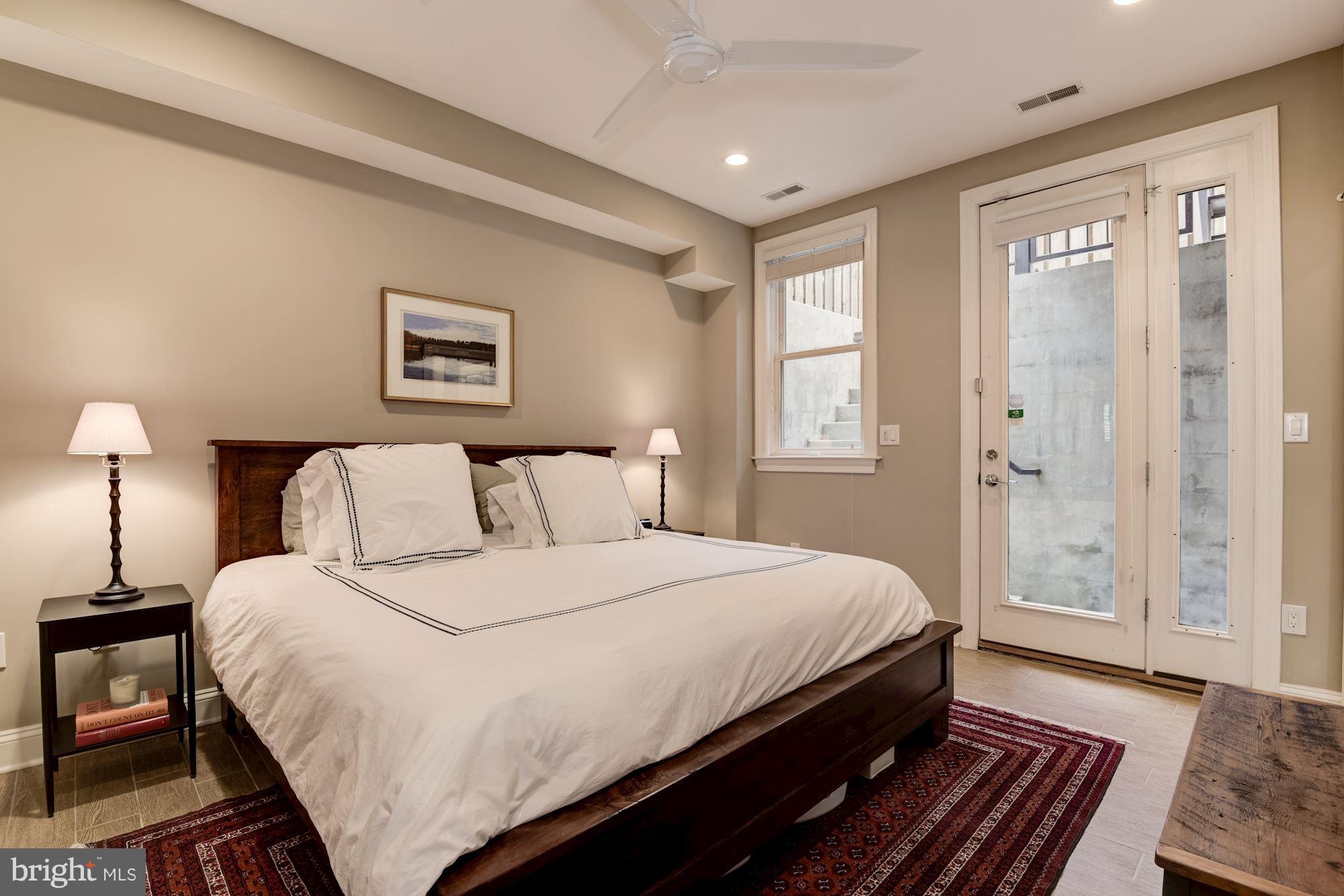 1431 Corcoran Street Northwest, Unit 1 Washington, DC 20009 - Photo 8 of 22 Master Bedroom w/ Walk-in Closet + En-Suite Bath