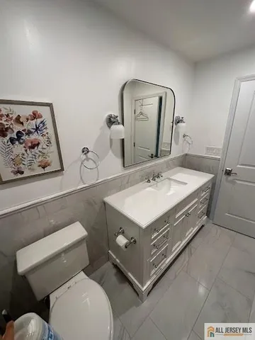 a view of a room with wooden floor and window