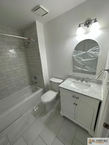 a bathroom with a shower and a toilet