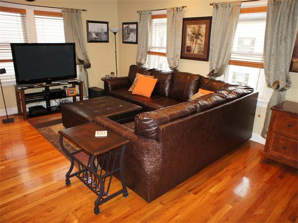 202 K Street, Unit 7 Boston, MA 02127 - Photo 2 of 10 a living room with furniture and a flat screen tv