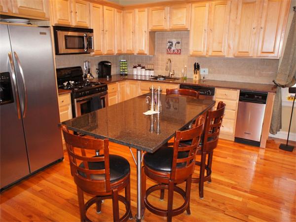 202 K Street, Unit 7 Boston, MA 02127 - Photo 3 of 10 a dining table with chairs and wooden floor