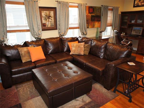 202 K Street, Unit 7 Boston, MA 02127 - Photo 4 of 10 a living room with furniture and a flat screen tv