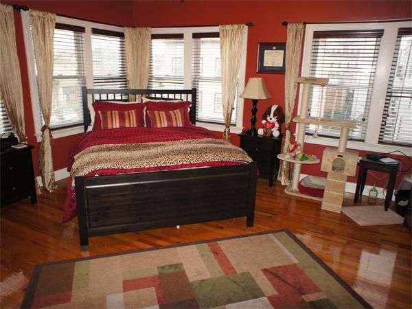202 K Street, Unit 7 Boston, MA 02127 - Photo 5 of 10 a bedroom with a bed and large windows