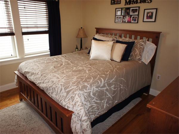202 K Street, Unit 7 Boston, MA 02127 - Photo 7 of 10 a large bed sitting in a bedroom next to a window