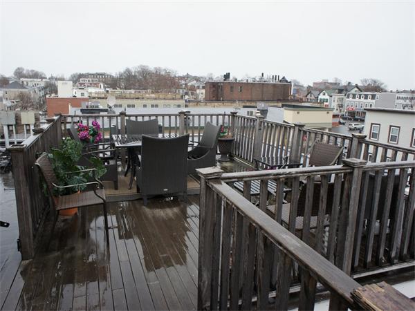 202 K Street, Unit 7 Boston, MA 02127 - Photo 10 of 10 a balcony with outdoor seating and city view