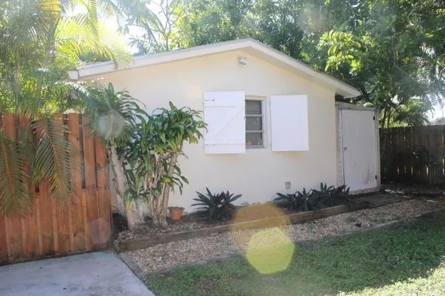 a backyard of a house with seating space
