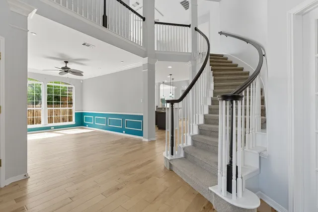 a view of an entryway with wooden floor