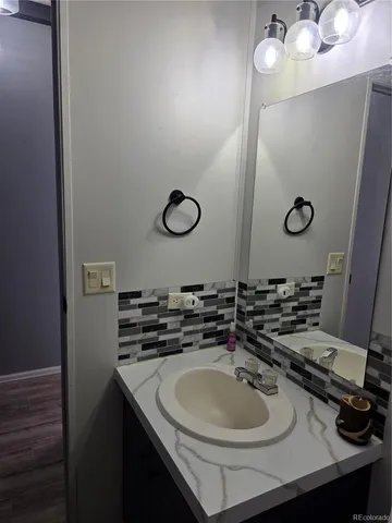 a bathroom with a sink and a mirror