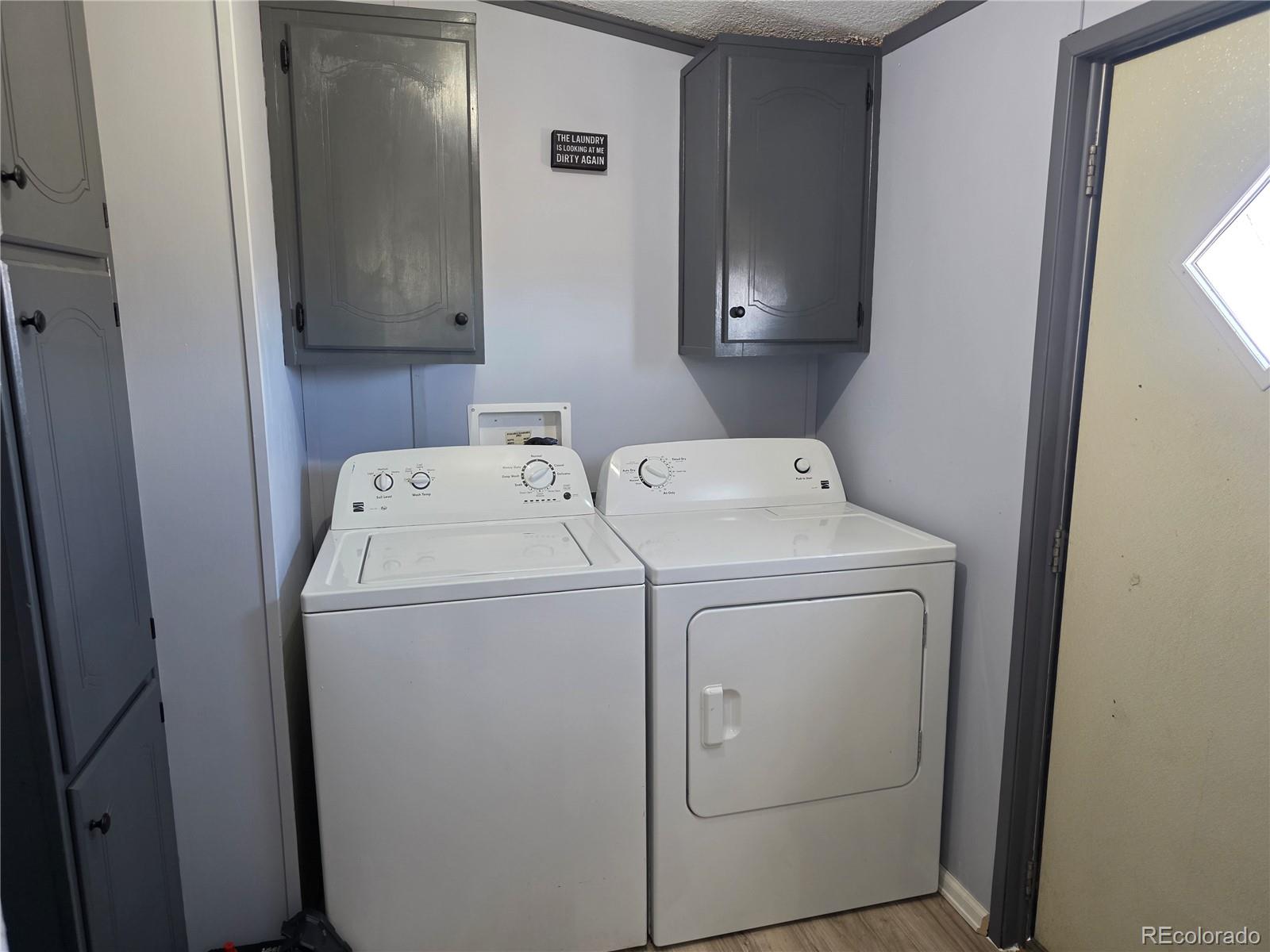 7881 Foothill Boulevard Alamosa, CO 81101 - Photo 16 of 25 a utility room with dryer and washer