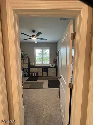 a view of a livingroom with furniture and a window
