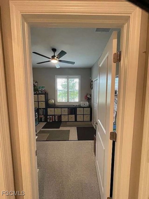 2190 Clementine Street Naples, FL 34120 - Photo 15 of 16 a living room with furniture and a chandelier