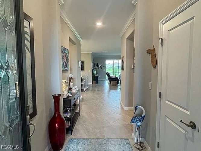 2190 Clementine Street Naples, FL 34120 - Photo 5 of 16 a view of a hallway with living room and furniture