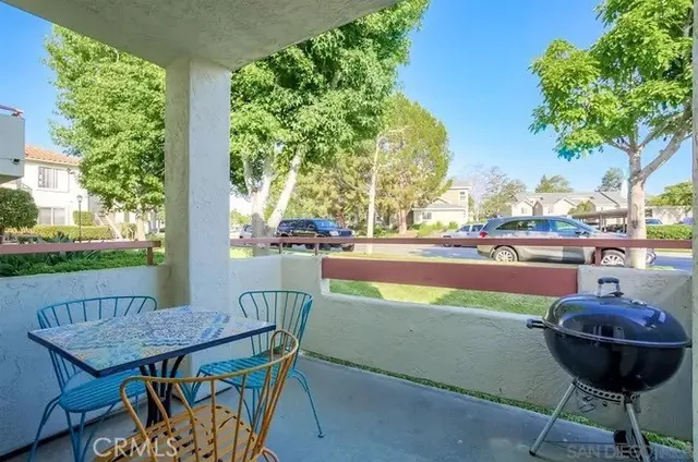 a table and chairs with the view of in the background