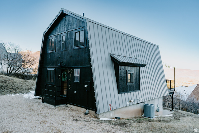 1413 Basel Drive Midway, UT 84049 - Photo 89 of 137 View of home's exterior with a metal roof and a gambrel roof