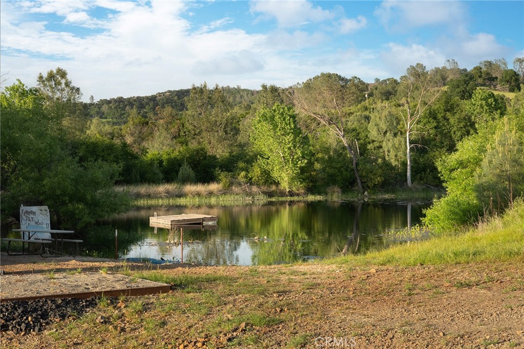1477 Flag Creek Road Oroville, CA 95965 - Photo 12 of 75 a view of a lake with a mountain in the background