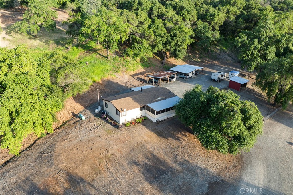 1477 Flag Creek Road Oroville, CA 95965 - Photo 21 of 75 an aerial view of a house with yard and greenery