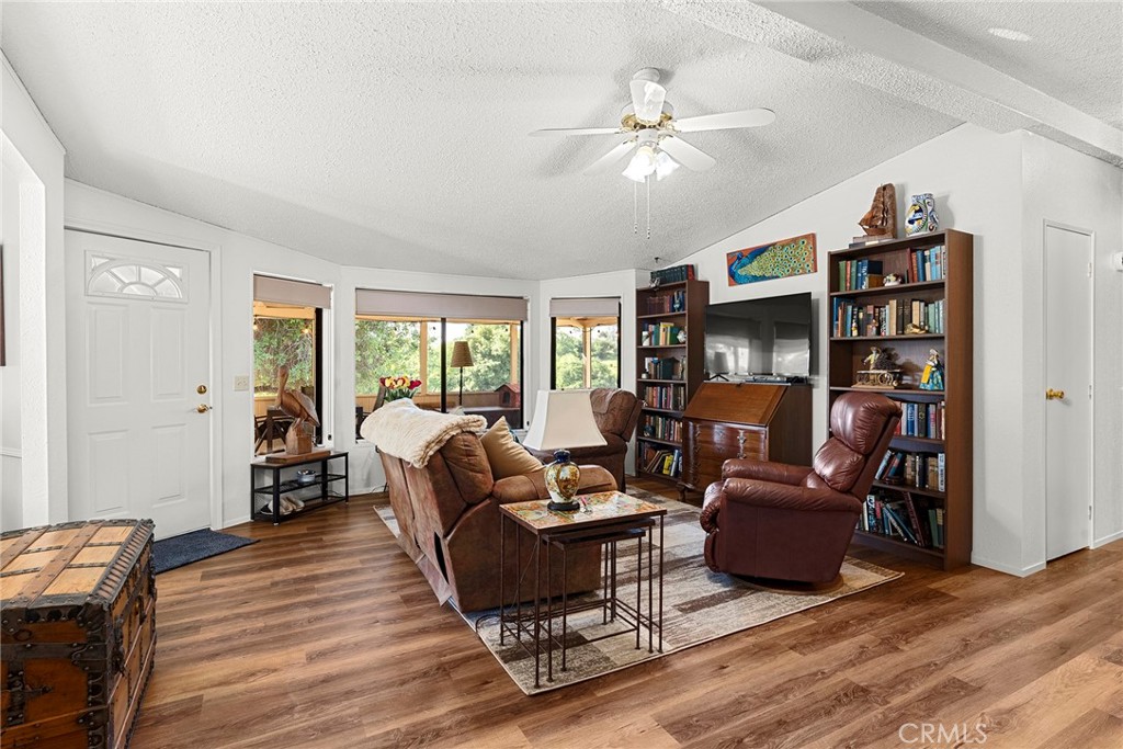 1477 Flag Creek Road Oroville, CA 95965 - Photo 22 of 75 a living room with furniture and a wooden floor