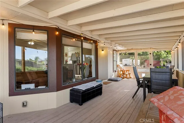 a view of a balcony with wooden floor