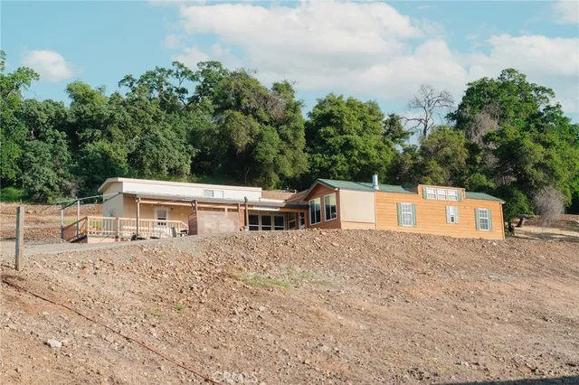 a view of a chair and table in the patio