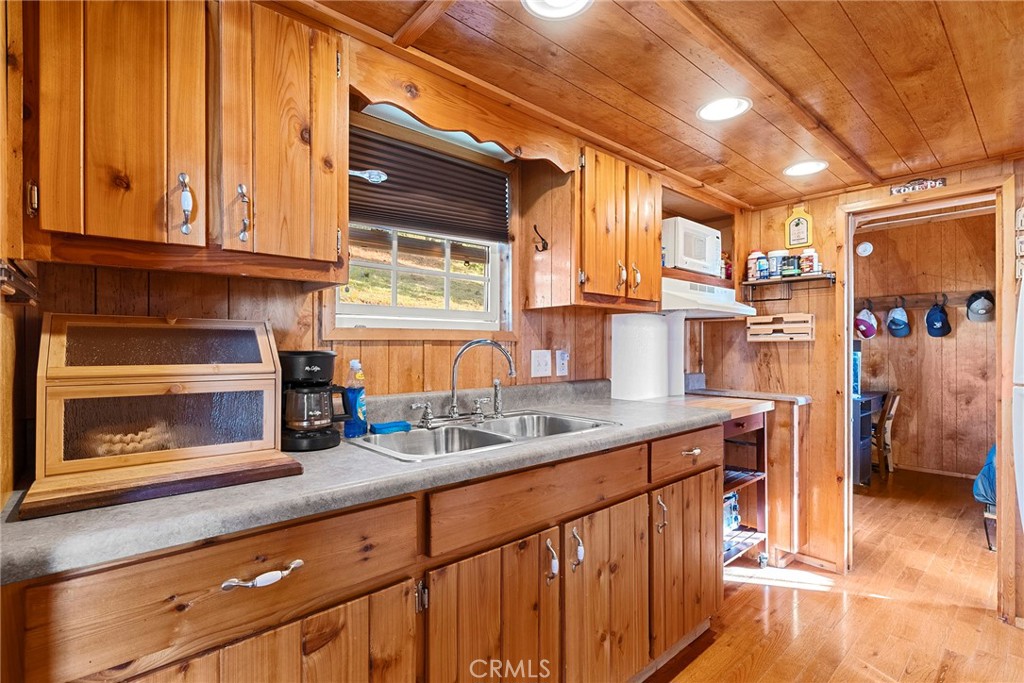 1477 Flag Creek Road Oroville, CA 95965 - Photo 41 of 75 a kitchen with stainless steel appliances granite countertop a sink and cabinets