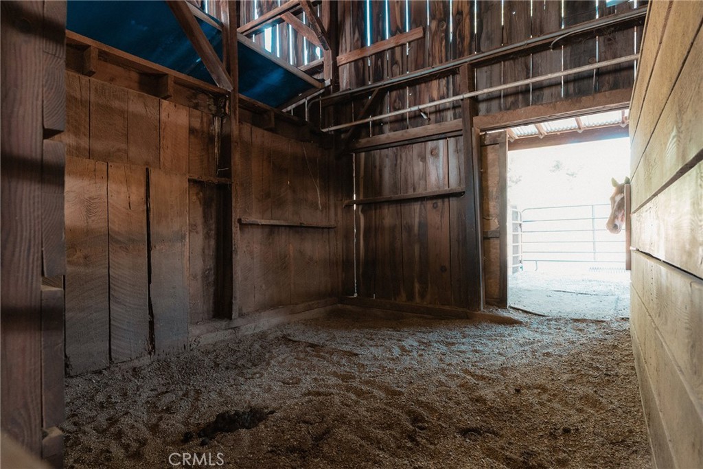 1477 Flag Creek Road Oroville, CA 95965 - Photo 48 of 75 a view of an empty room with wooden walls