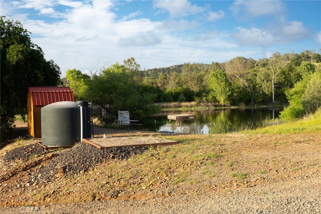 1477 Flag Creek Road Oroville, CA 95965 - Photo 57 of 75 a view of a lake with a house in the background