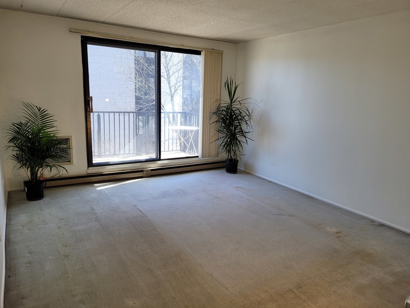 9701 Dee Road, Unit 4F Niles, IL 60714 - Photo 2 of 20 a view of an empty room with a window