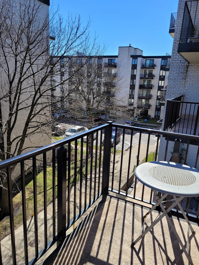 9701 Dee Road, Unit 4F Niles, IL 60714 - Photo 6 of 20 a view of a balcony with chairs