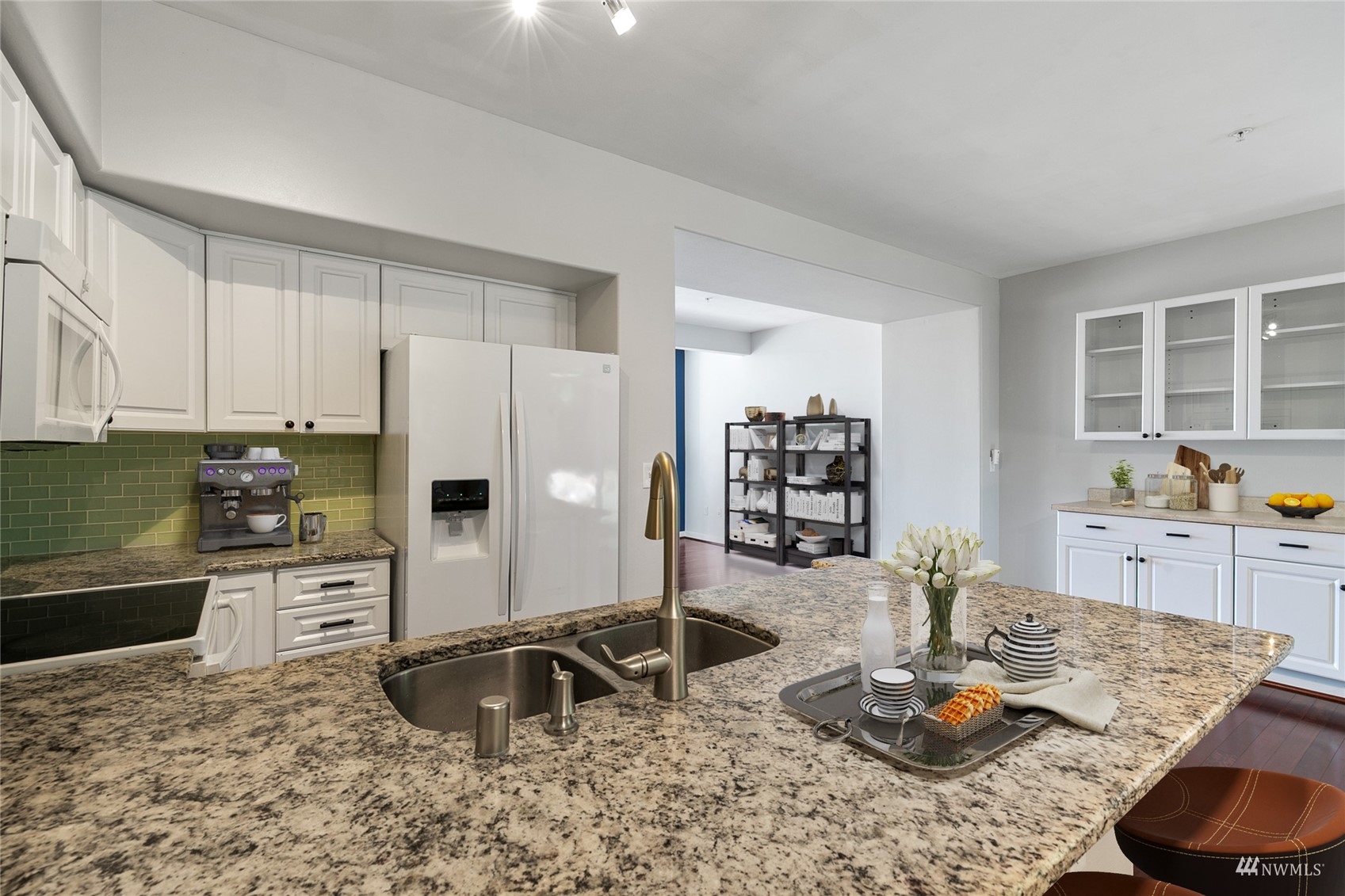 23300 Southeast Black Nugget Road, Unit D3 Issaquah, WA 98029 - Photo 11 of 27 a kitchen with sink and refrigerator