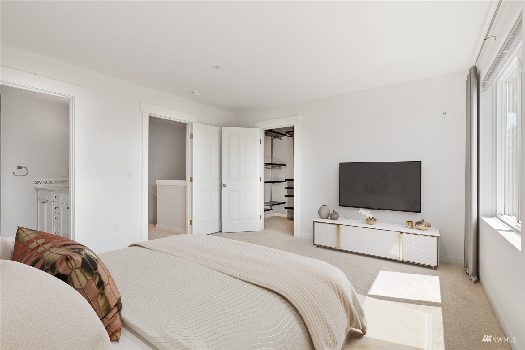 23300 Southeast Black Nugget Road, Unit D3 Issaquah, WA 98029 - Photo 17 of 27 a bedroom with a bed and a flat screen tv