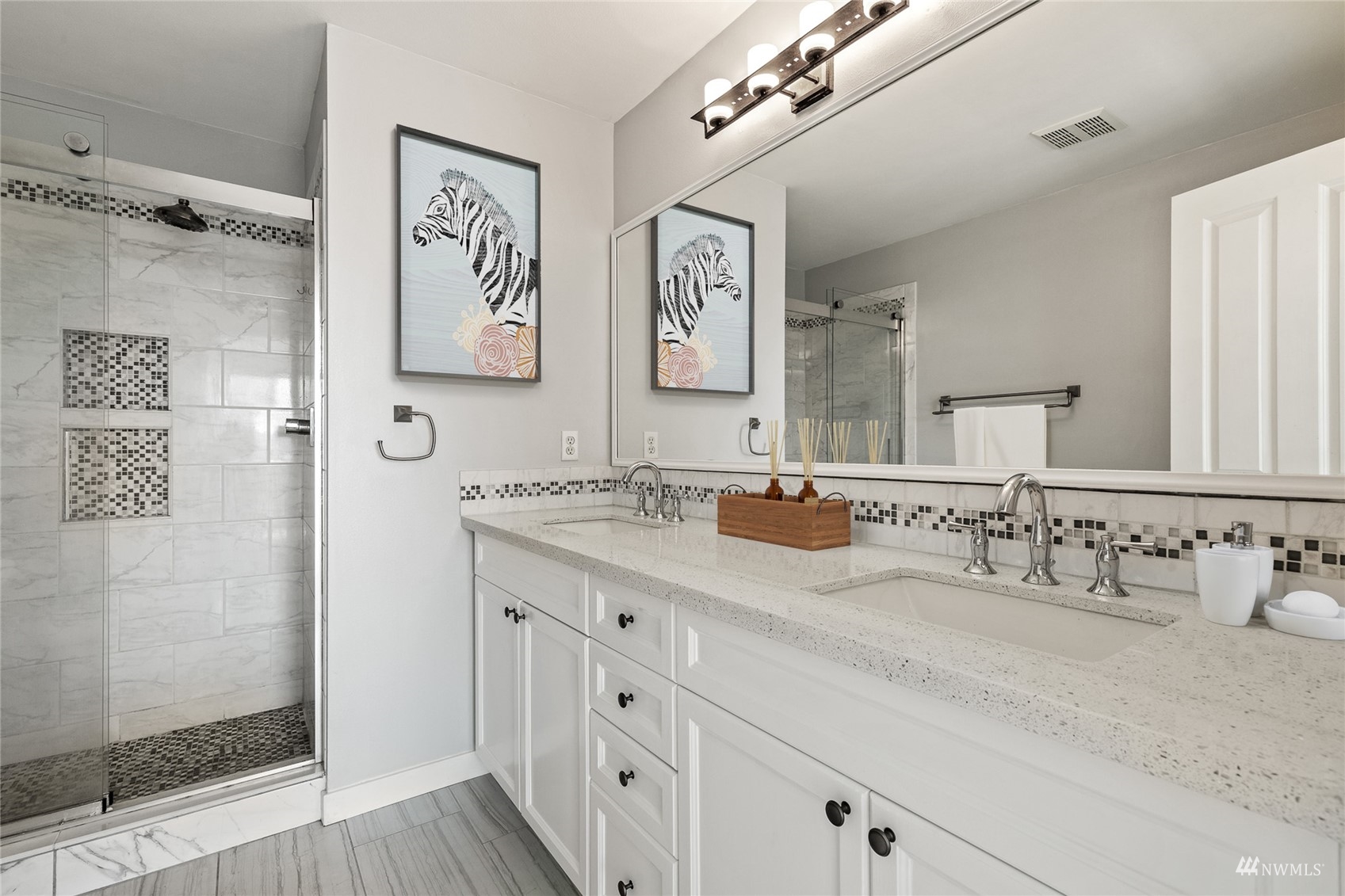 23300 Southeast Black Nugget Road, Unit D3 Issaquah, WA 98029 - Photo 19 of 27 a bathroom with double vanity sink and a mirror