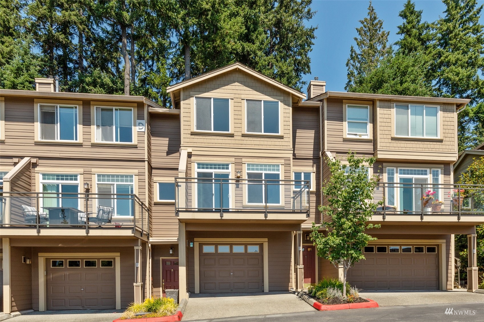 23300 Southeast Black Nugget Road, Unit D3 Issaquah, WA 98029 - Photo 2 of 27 a front view of residential houses