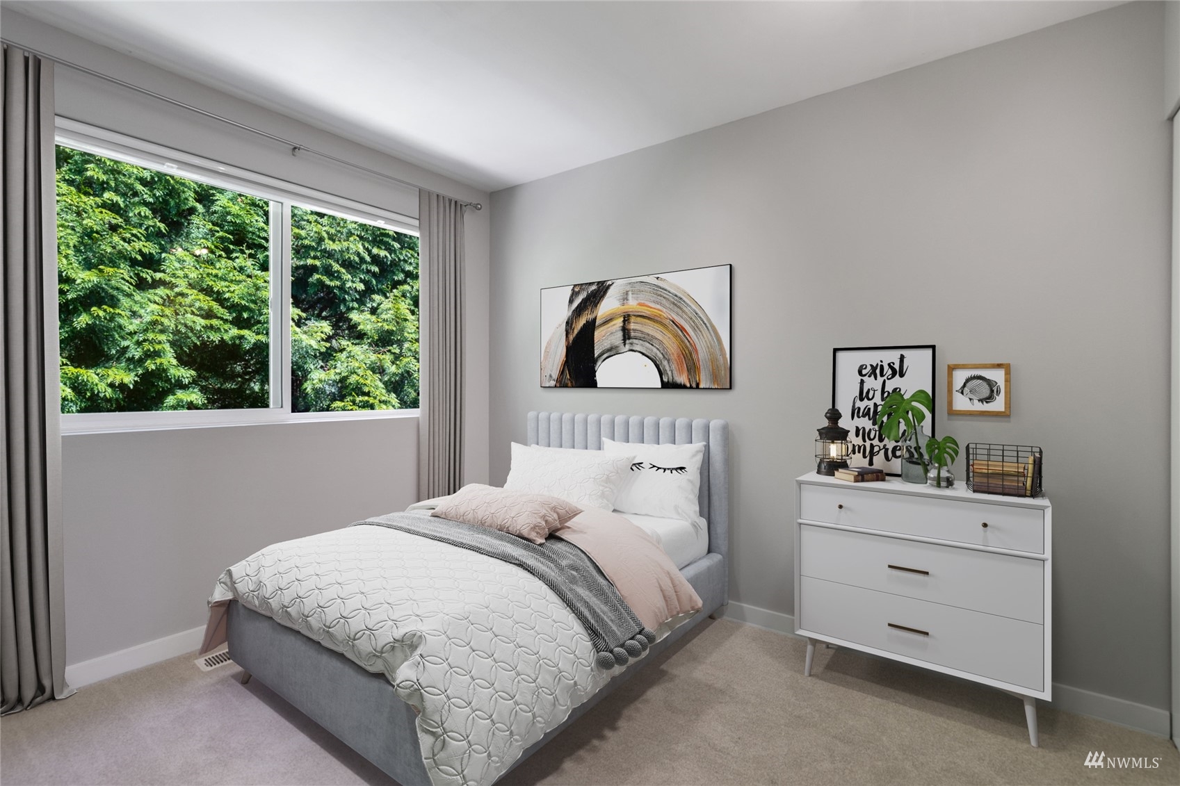 23300 Southeast Black Nugget Road, Unit D3 Issaquah, WA 98029 - Photo 23 of 27 a bedroom with a bed and a dresser next to a window