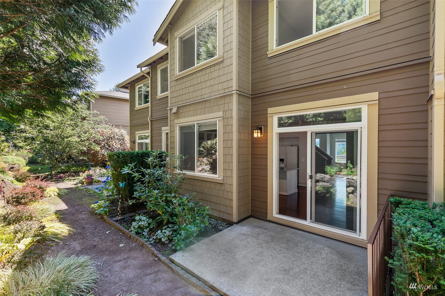 23300 Southeast Black Nugget Road, Unit D3 Issaquah, WA 98029 - Photo 26 of 27 front view of a house with a yard