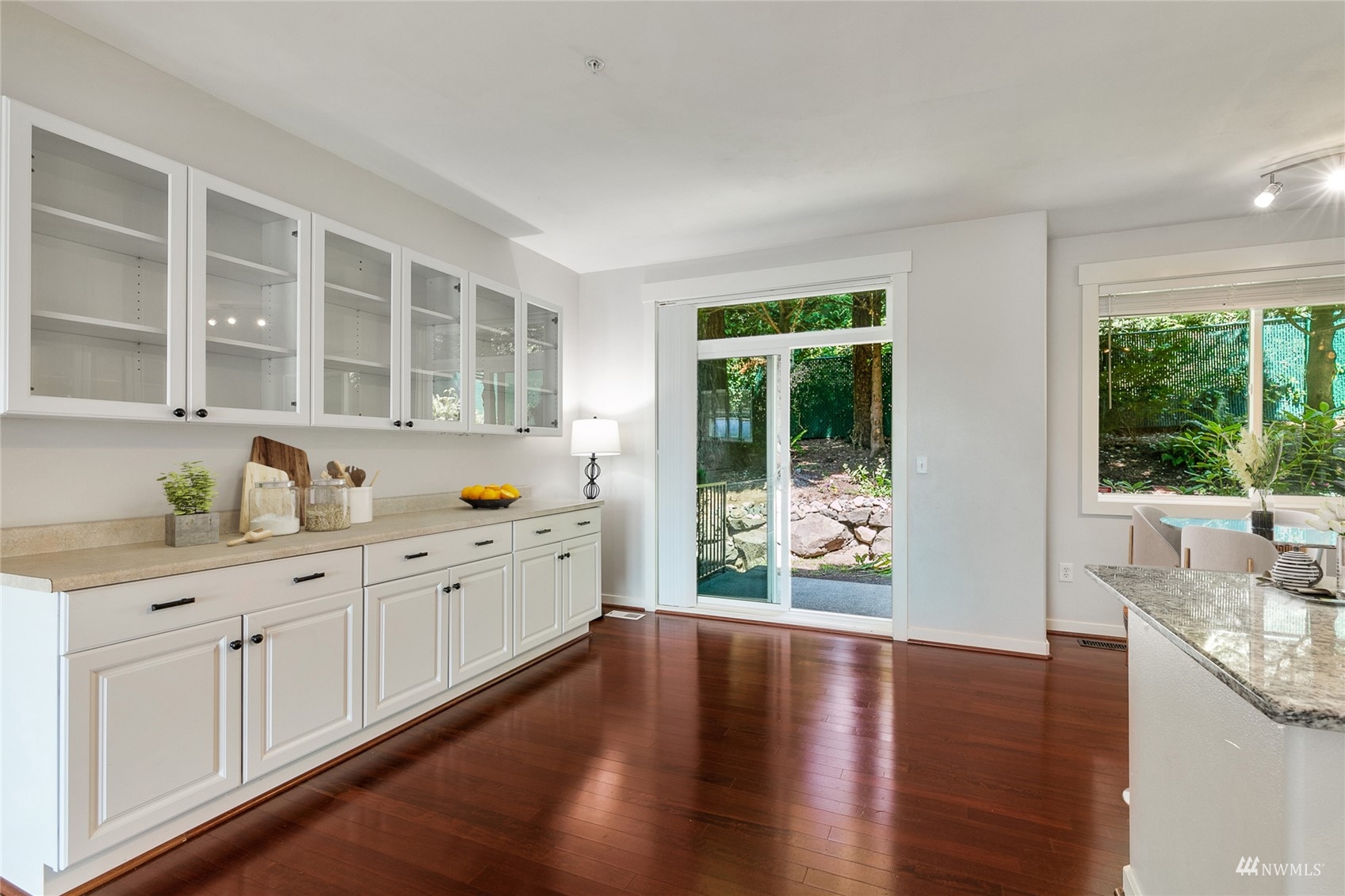 23300 Southeast Black Nugget Road, Unit D3 Issaquah, WA 98029 - Photo 8 of 27 a large white kitchen with granite countertop a large window