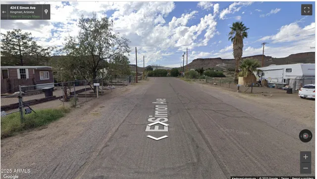a view of a backyard with sitting area and entertaining space