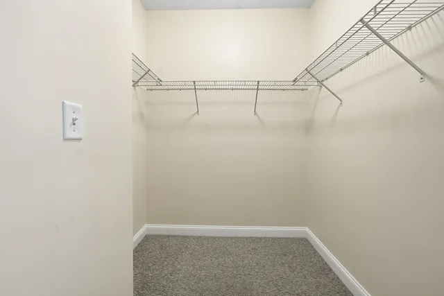 a view of small space with empty racks on the wall