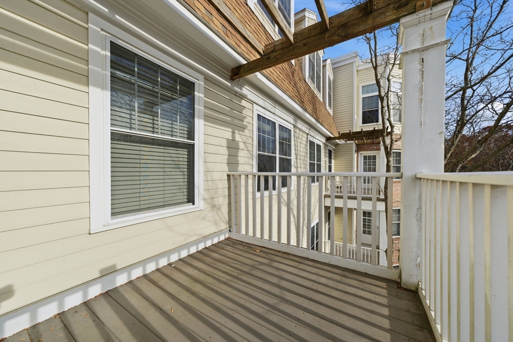 295 Salem Street, Unit 82 Woburn, MA 01801 - Photo 22 of 36 a view of a brick house with wooden floor