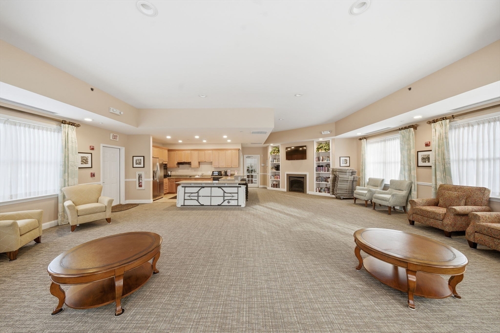 295 Salem Street, Unit 82 Woburn, MA 01801 - Photo 29 of 36 a living room with furniture and a large window